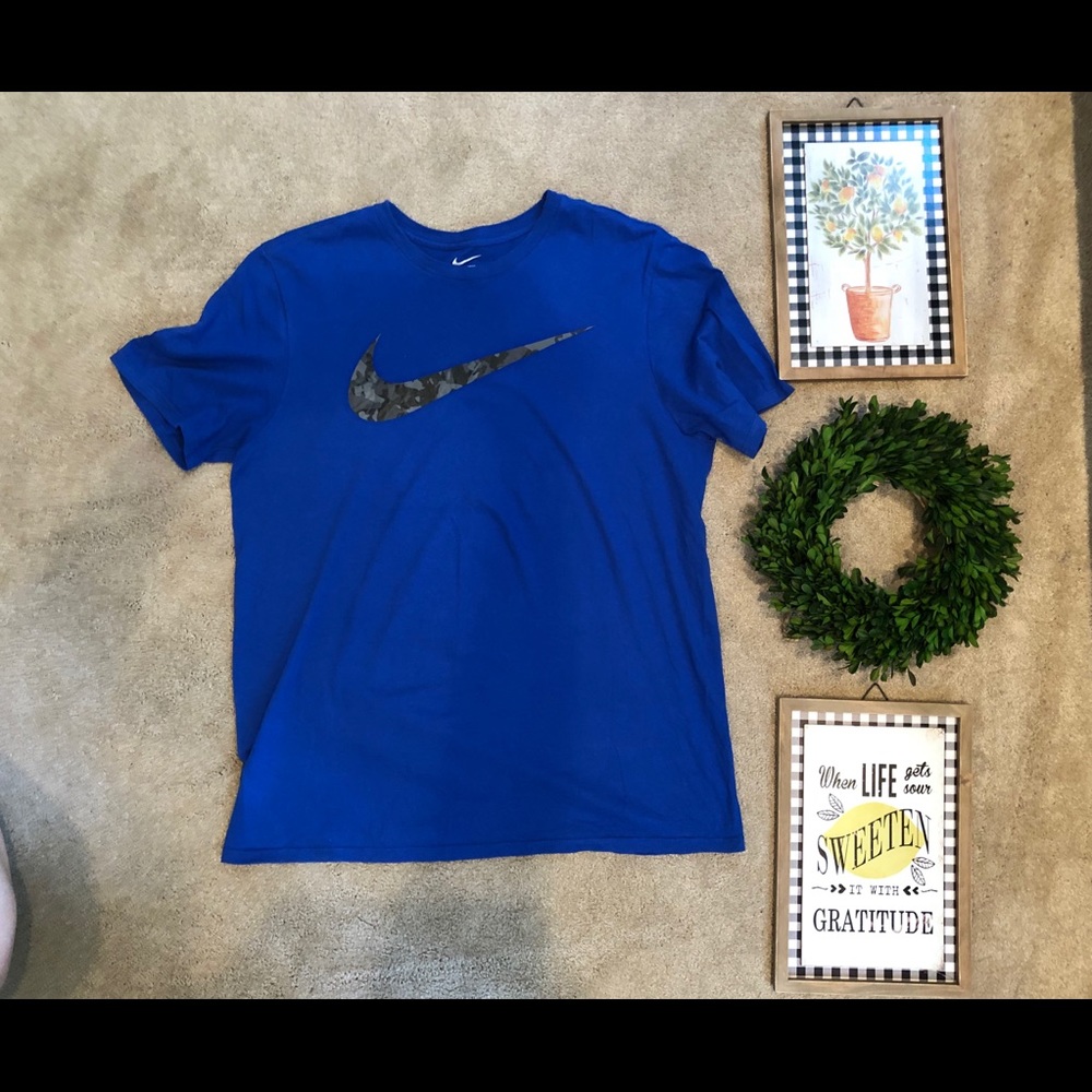 Gently used blue Nike with camo swoosh t-shirt. - Picture 1 of 1